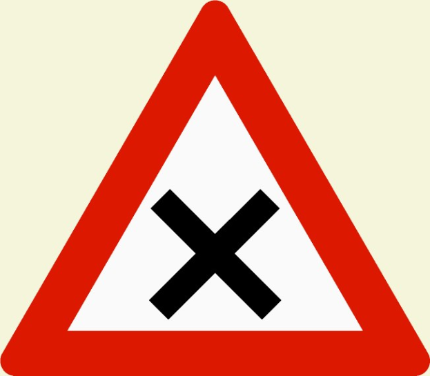 Rote und weiße dreieckige Warnstraße mit einem schwarzen Kreuz, das eine potentielle Straßenüberquerungsgefahr anzeigt.