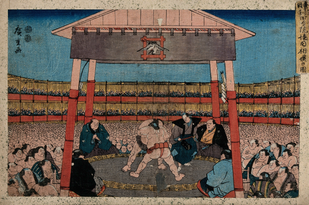 Ein Gemälde eines Sumo-Kampfes in einem Stadion mit Zuschauern im Vordergrund und einer Hütte im Hintergrund von Utagawa Kunisada Toyokuni III aus der Serie Fifty-Three Stations of the Tokaido.