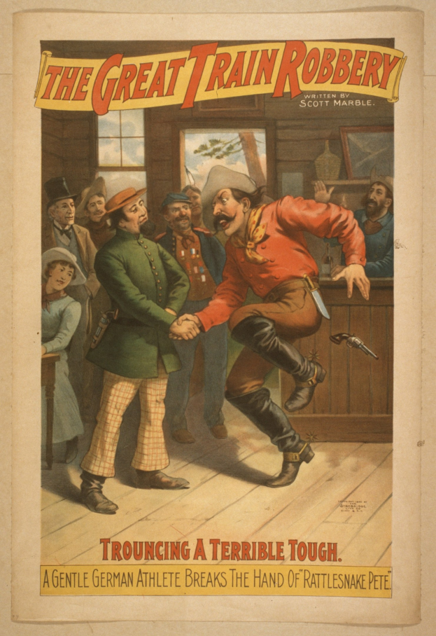 Plakat, das eine Gruppe von Menschen auf einem Boden zeigt, einer hält eine Waffe, mit einem Fenster und einer Wand im Hintergrund und Text, der oben und unten "The Great Train Robbery - Trouching a Terrible Tough" liest.